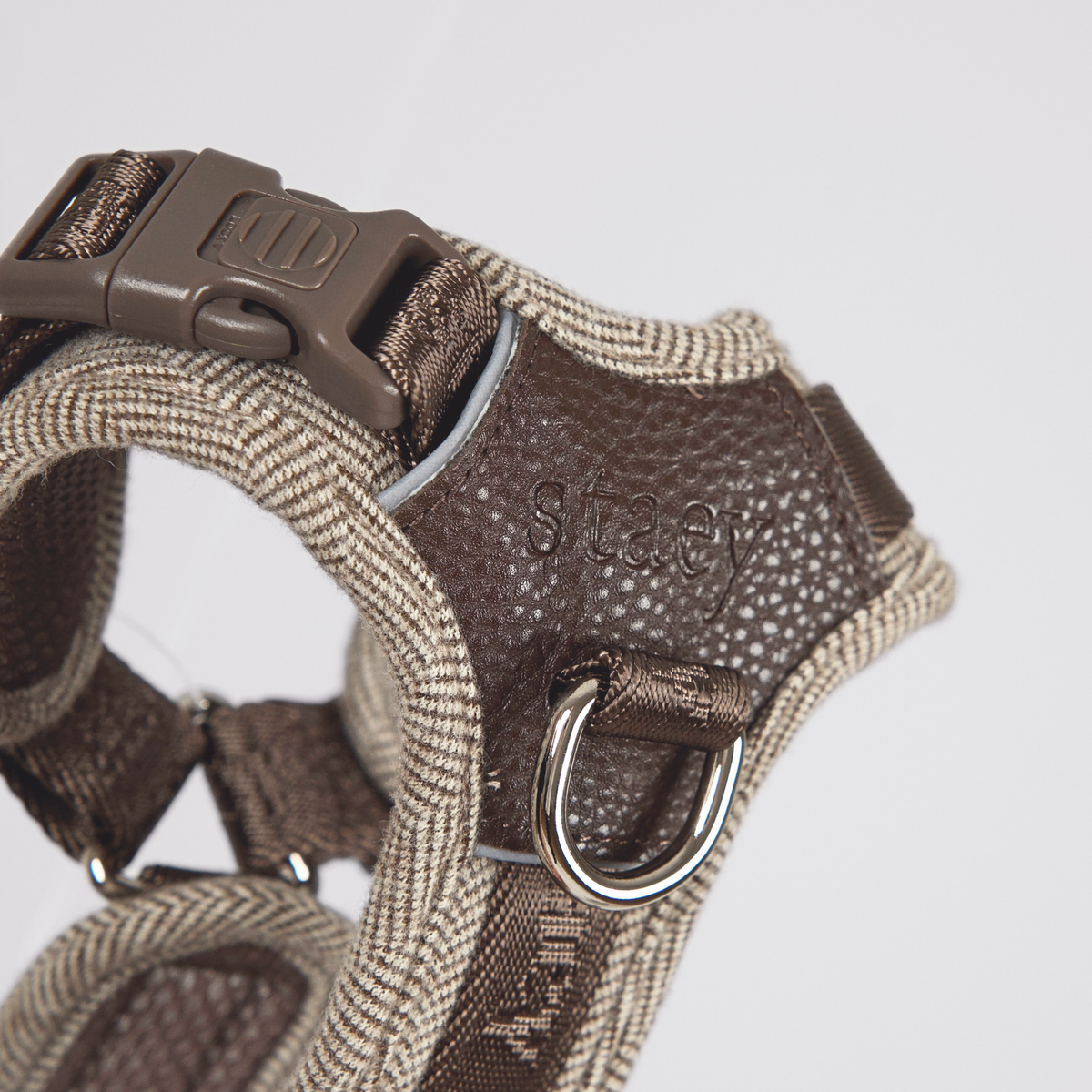 Close-up of the D-ring and buckles on the dark oak Numa harness